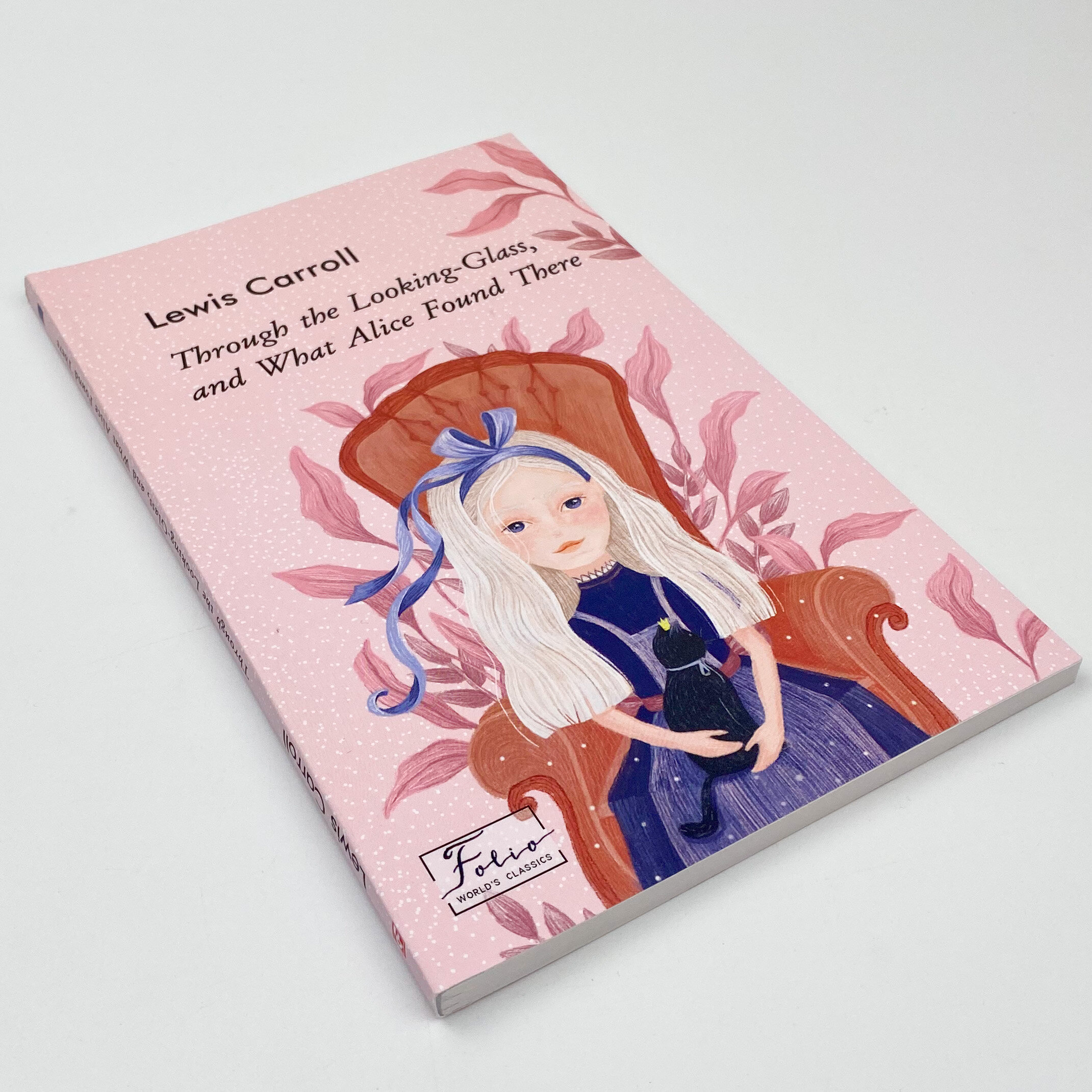 Through the Looking-Glass, and What Alice Found There (Аліса в Задзеркаллі). Автор — Льюис Кэрролл. 